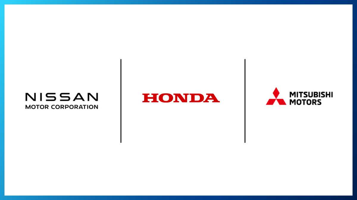 Executives from Honda, Nissan, and Mitsubishi signing a memorandum of understanding for a historic merger.